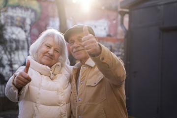 Medium shot senior people showing thumbs up