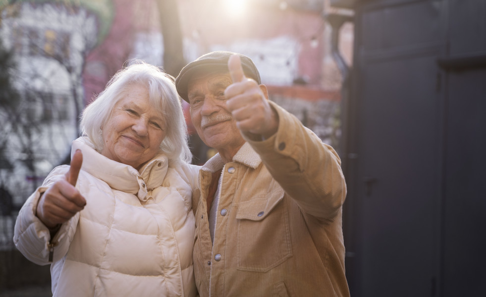 Medium shot senior people showing thumbs up